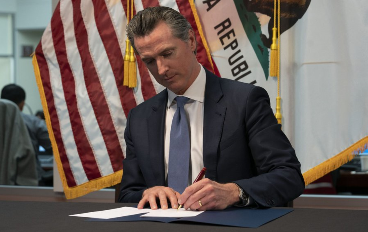 Governor Gavin Newsom signing AB 1267