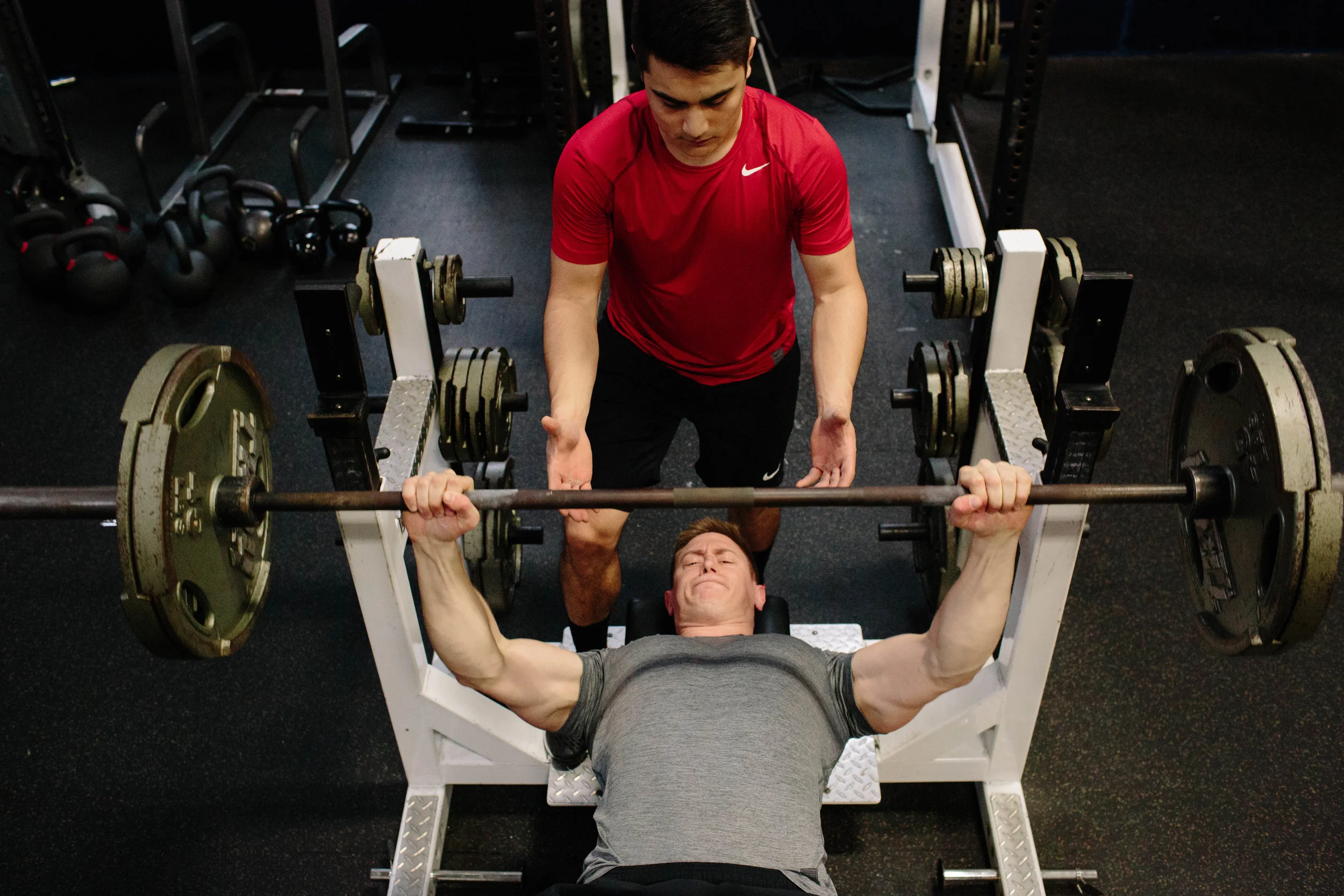 gym spotter safety hand placement