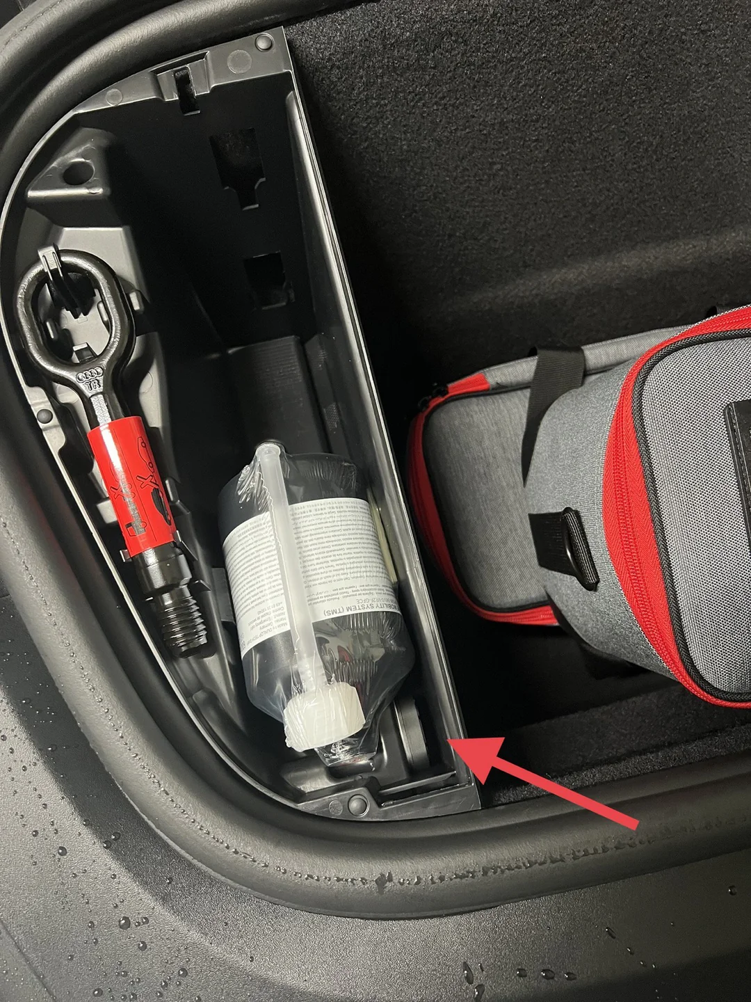 AirTag hidden under trunk liner