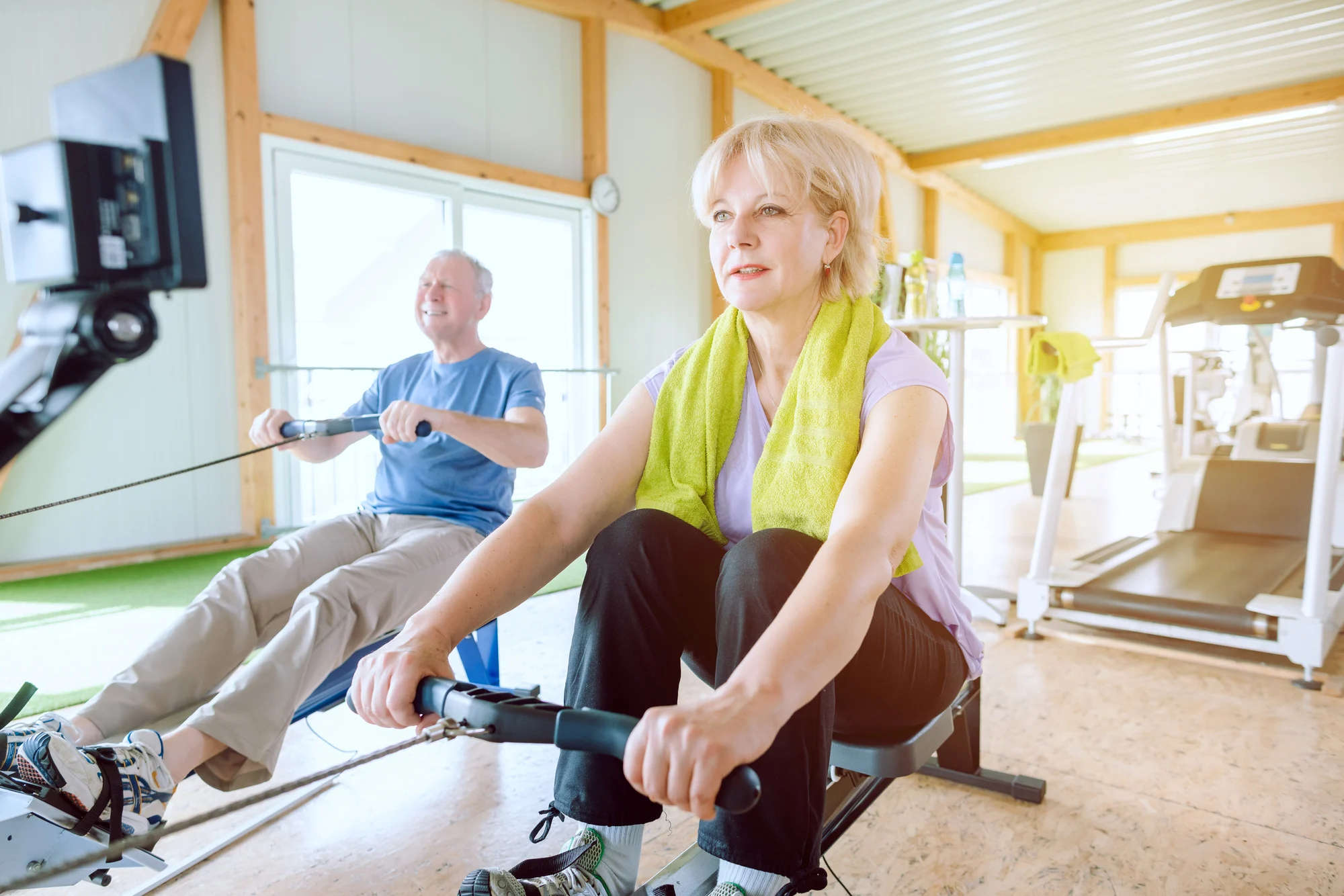 seniors using rowing machines