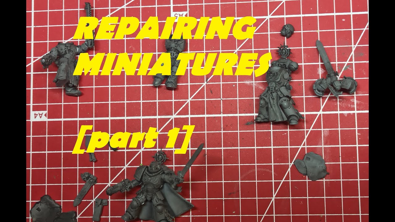 Warhammer hobbyist repairing figures